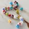 12 Packs: 25 ct. (300 total) Millefiori Flower Glass Round Beads by Bead Landing™
